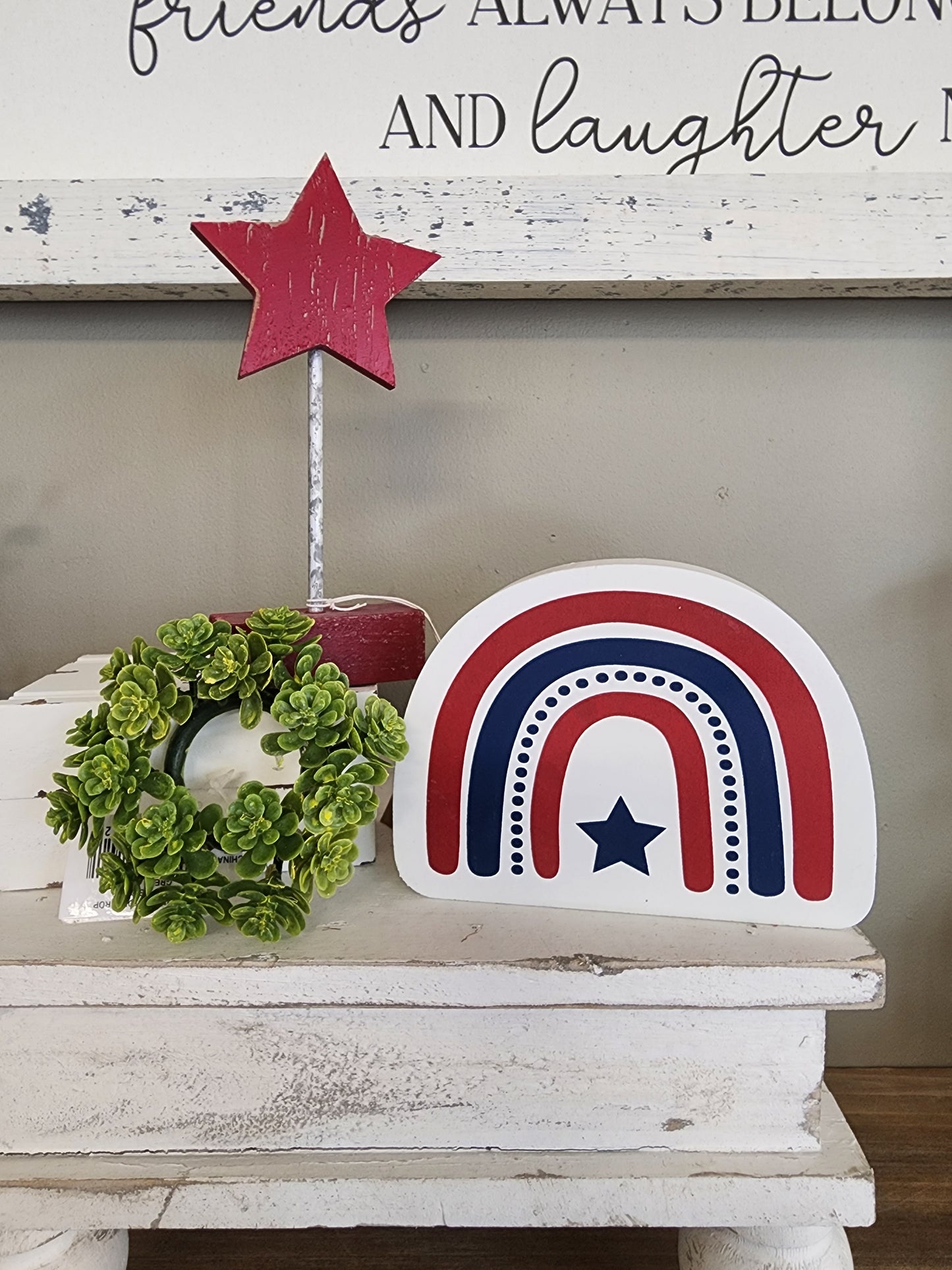 Rainbow USA Small Tiered Tray Sign. This Small Guy is great for tier trays, rae dunn setups, 4th of July shelves, or mantels. Cute to add to a tray or table centerpiece. This guy is wooden and painted red white and blue so it matches the classic Fourth of July color set. 