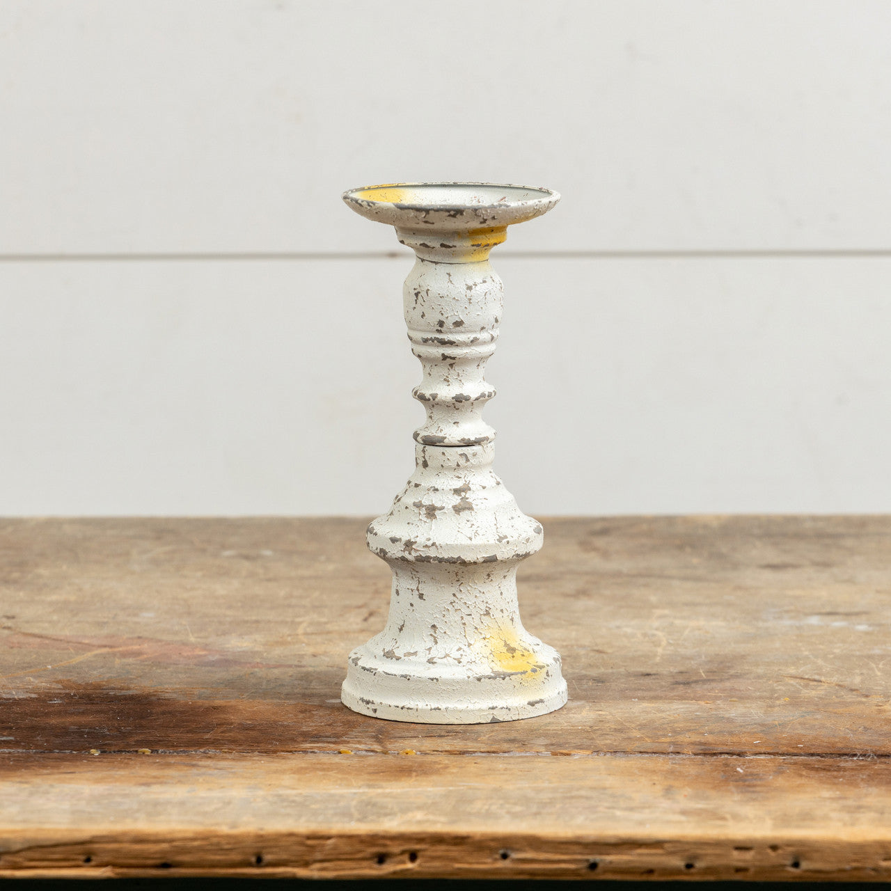 White Candle stick, great accent for any home. Add this to a mantel, shelf or dinning table to add that vintage look. W: 4" H: 8.75" Candle stick is 8.75" tall *this listing is for 1 candle stick only all other decor and candles are not included8.75" Aged